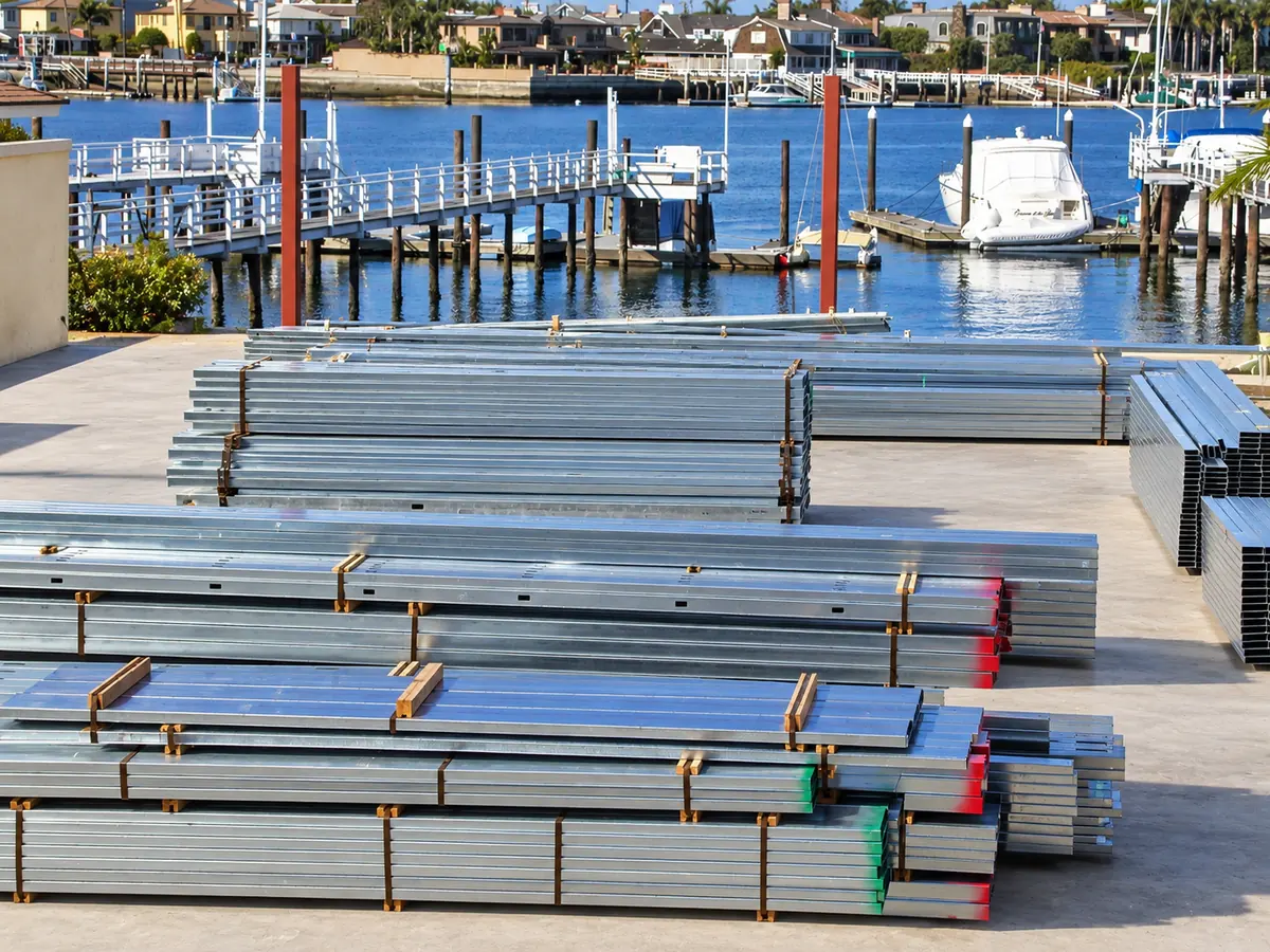 Bundles of prepared cold-formed steel framing members banded, color-marked and staged for delivery